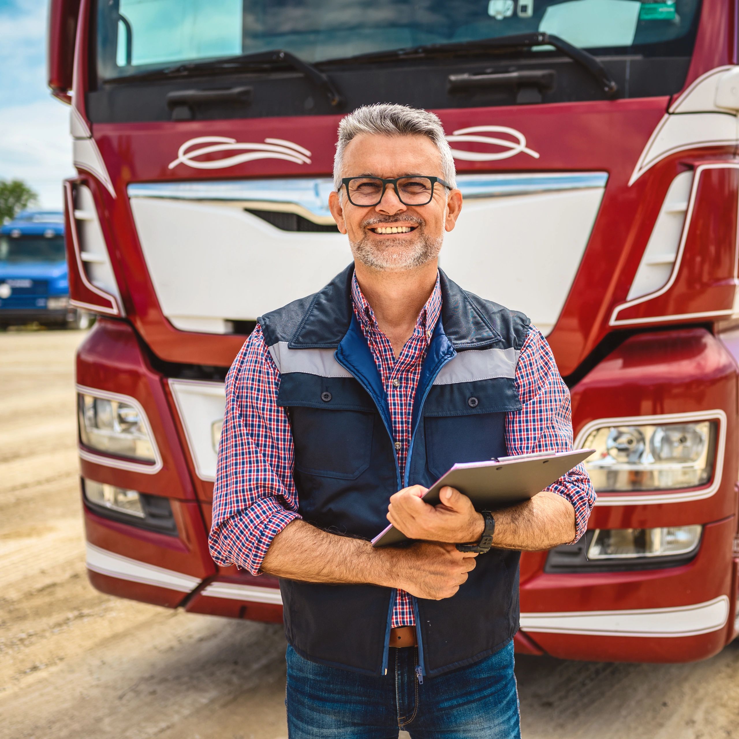 Portrait of a truck driver holding a clipboard