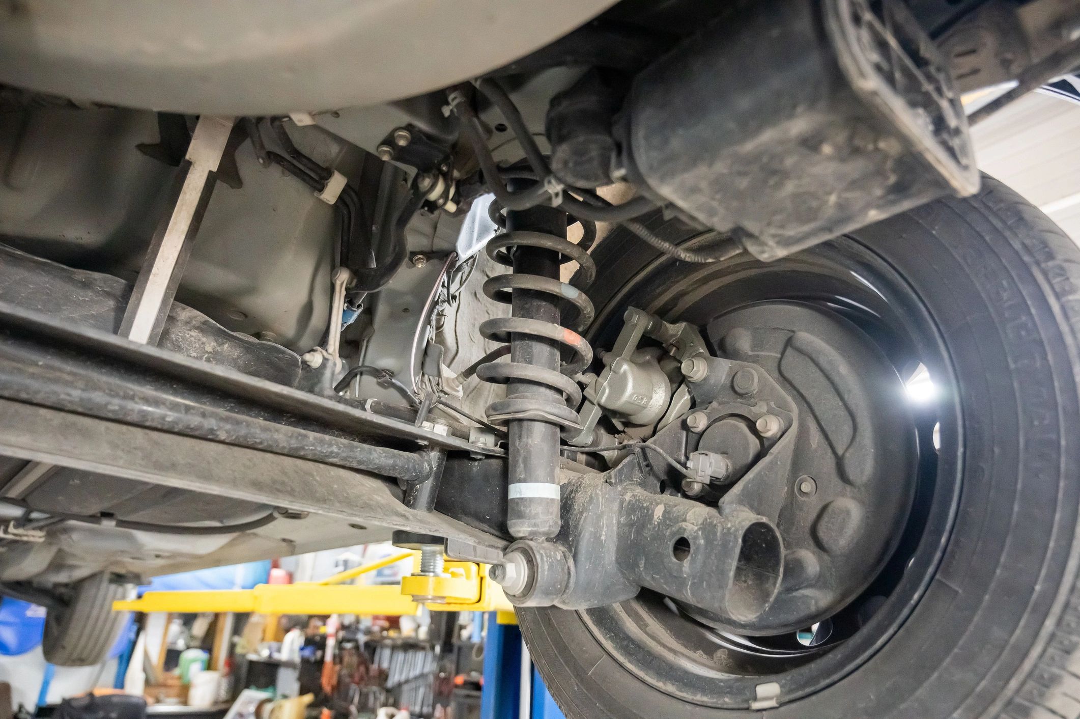 Close-up of suspension spring and shock assembly